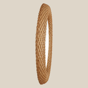 Woven circular object on a beige background - Number 4