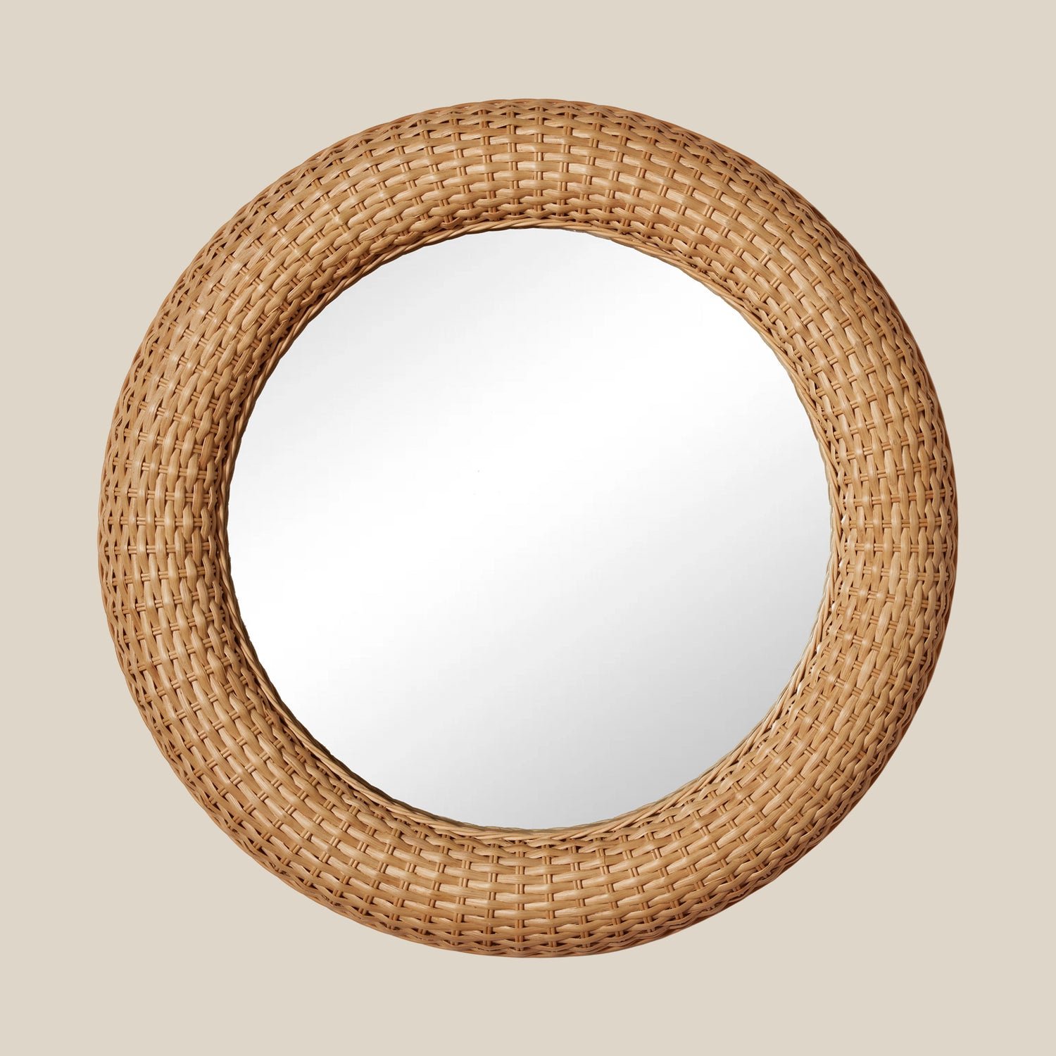 Round mirror with a woven rattan frame on a beige background- Number 1