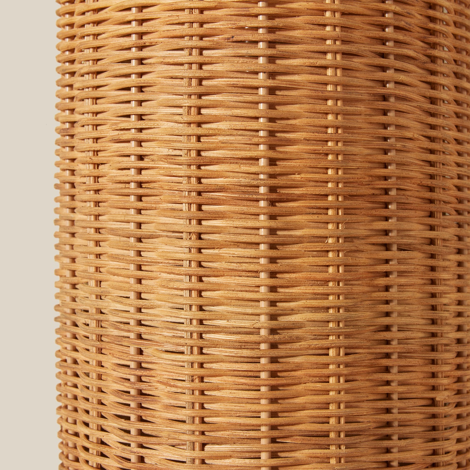 Close-up of a woven rattan sconce on a beige background- Number 5