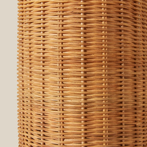 Close-up of a woven rattan sconce on a beige background - Number 5