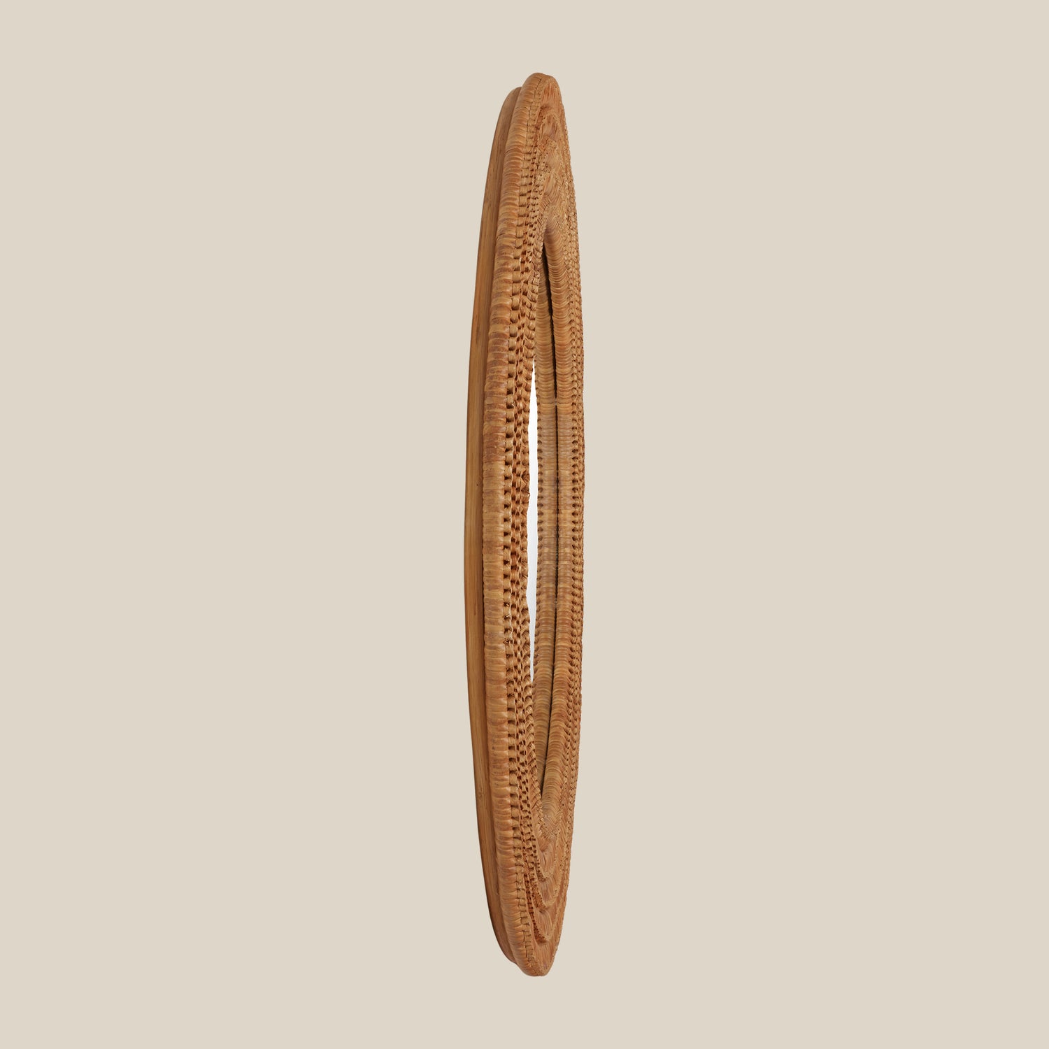 Woven brown mirror on a beige background- Number 3