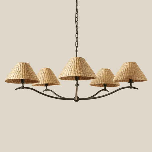 Chandelier with wicker lampshades on a beige background