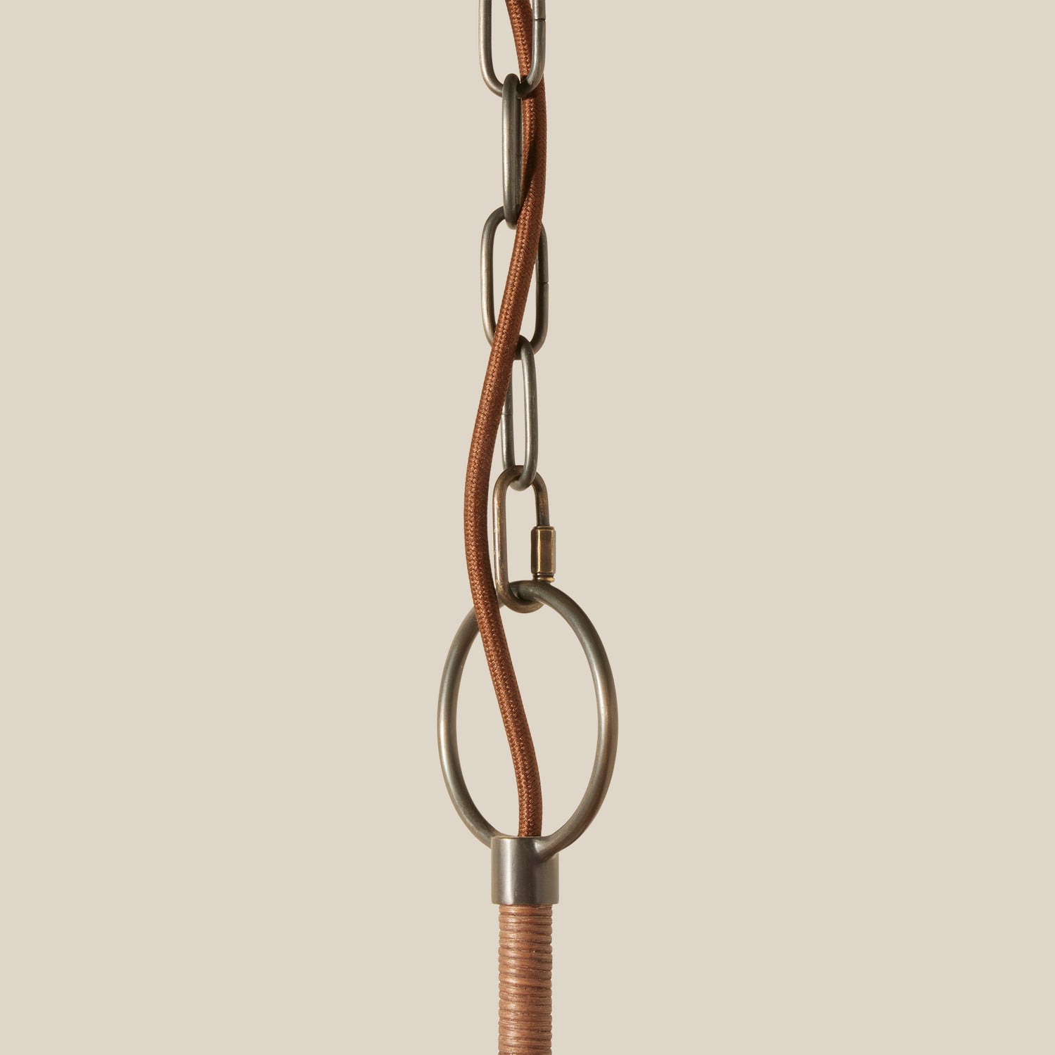 Close-up of a metal chain with a beige background- Number 4