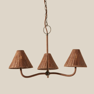 Wicker chandelier with three lampshades on a beige background - Number 1