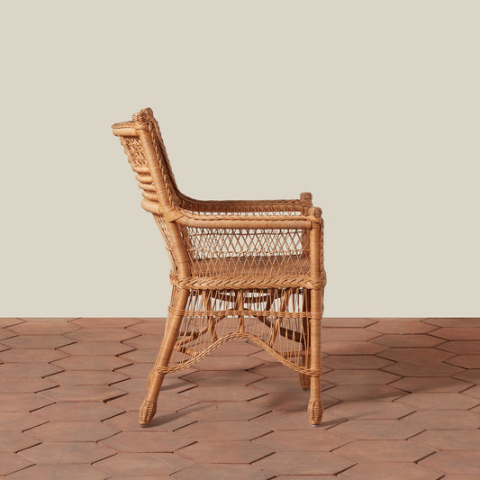 Wicker chair on a wooden floor with a neutral background - Image 2