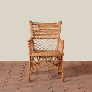 Wicker chair on a stone floor with a neutral background - Number 3