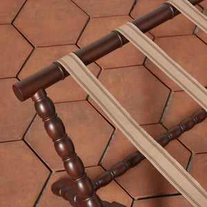 Wooden chair with a strap on a terracotta tile floor - Number 5