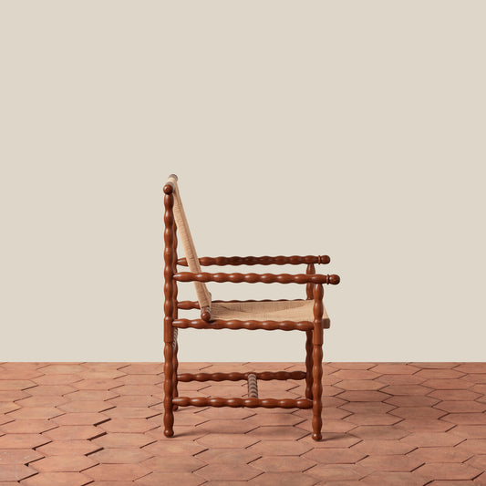 wooden arm chair on tile floor against beige background - Image 2