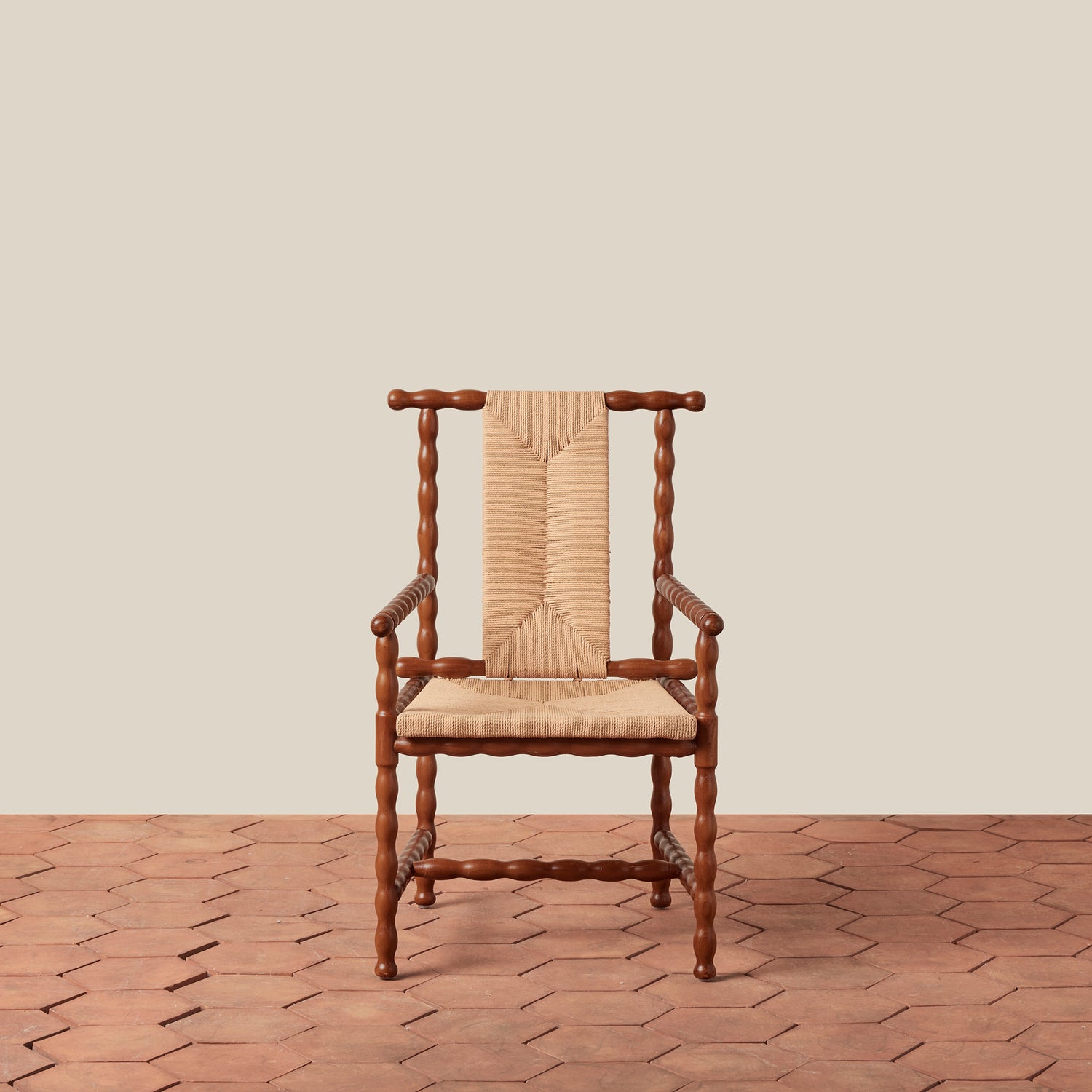 wooden arm chair on tile floor against beige background- Number 3