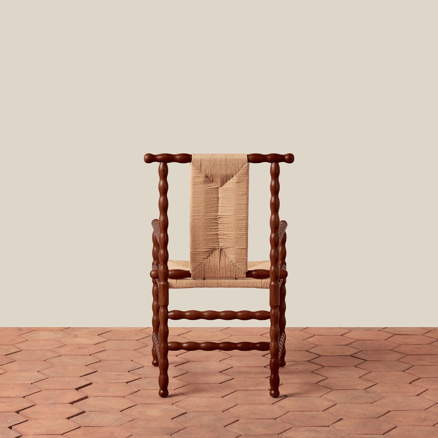 Wooden chair with woven backrest on a wooden floor and beige wall- Number 5