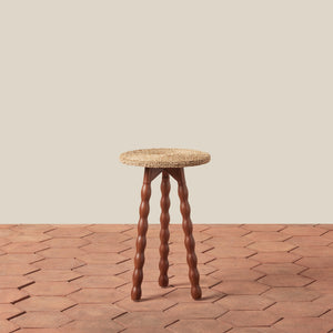 wood stool on tile floor against beige wall - Number 1