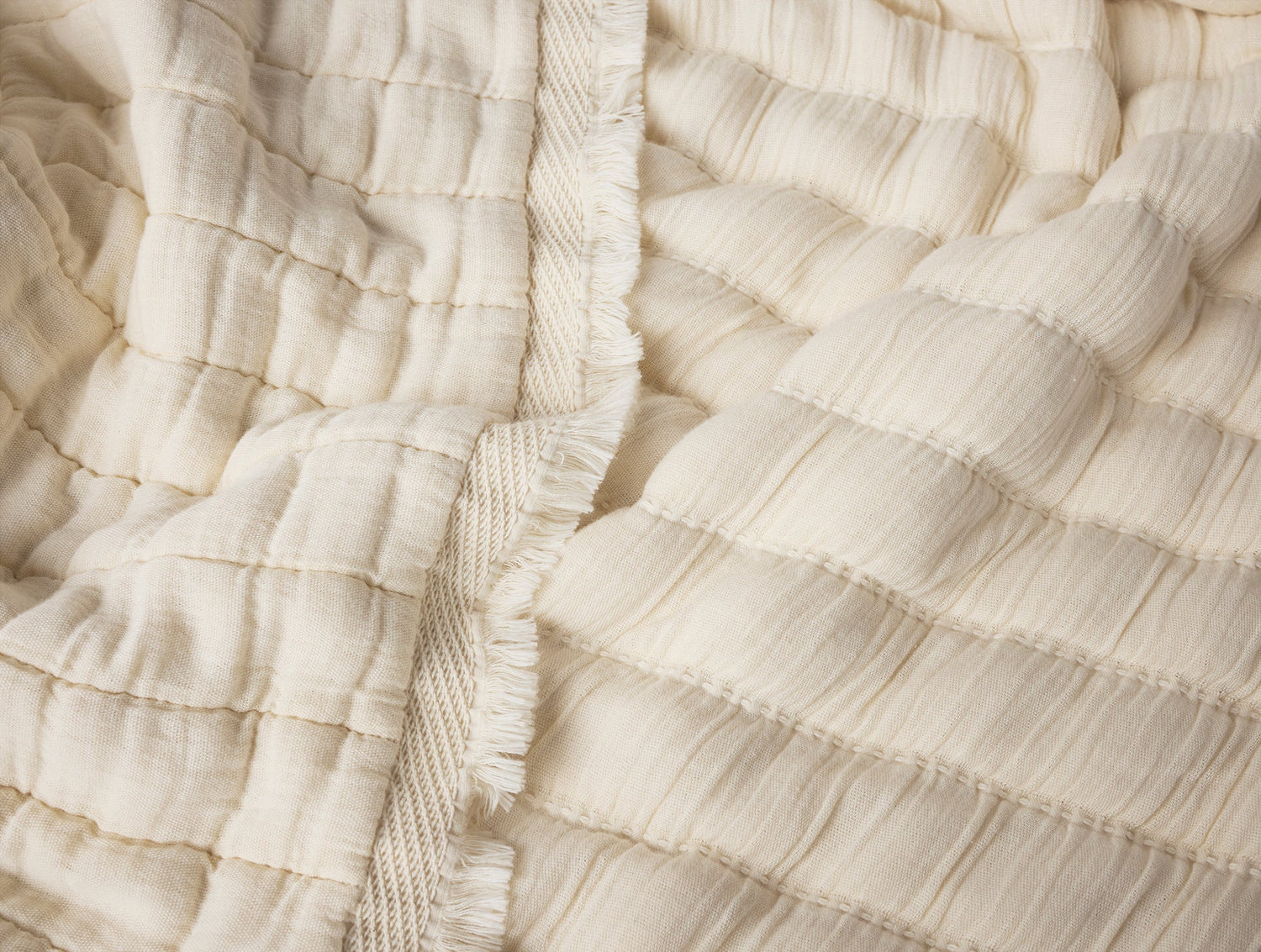 Close-up of textured beige fabric with a woven pattern- Number 3