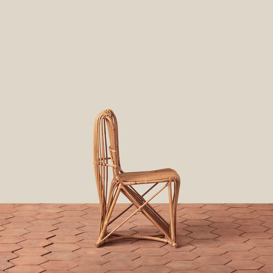 Woven rattan chair on a wooden floor with a neutral background - Image 2