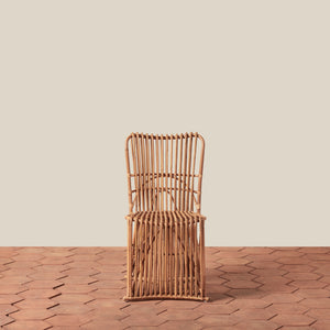 Woven chair on a wooden floor with a beige wall background - Number 3