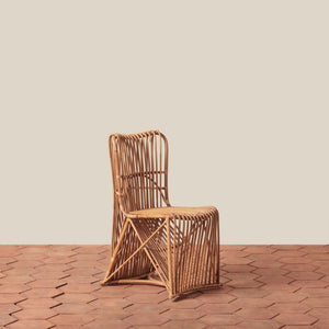 Woven chair on a wooden floor with a beige wall background - Number 1