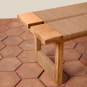 Wooden bench with woven backrest on a hexagonal tile patio - Number 5