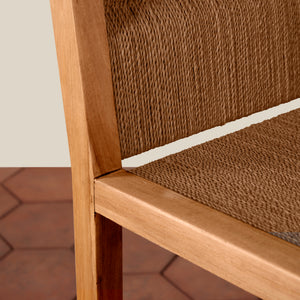 Close-up of a wooden chair with woven brown seat and backrest. - Number 8