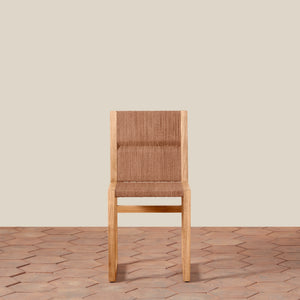 Wooden chair with woven backrest on a wooden floor and beige wall background - Number 5