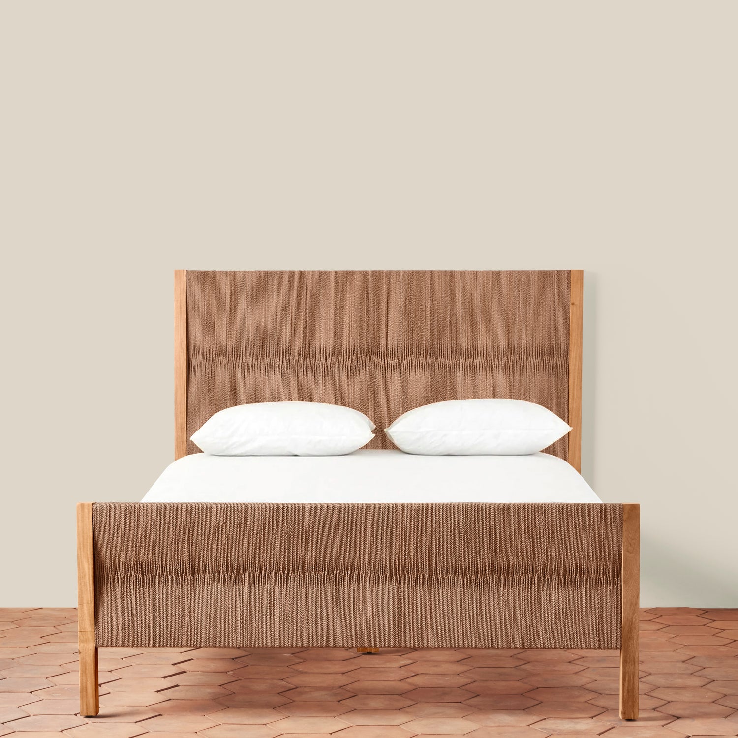 Wooden bed with white bedding against a beige wall- Number 4