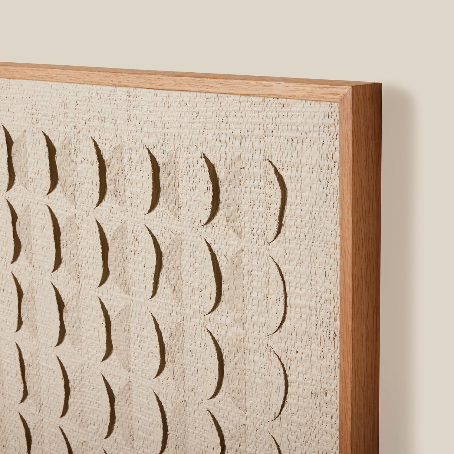 Textured wall art with a wooden frame on a beige background- Number 3