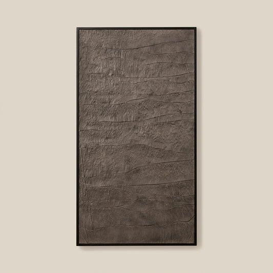 Textured rectangular object with a black frame on a beige background