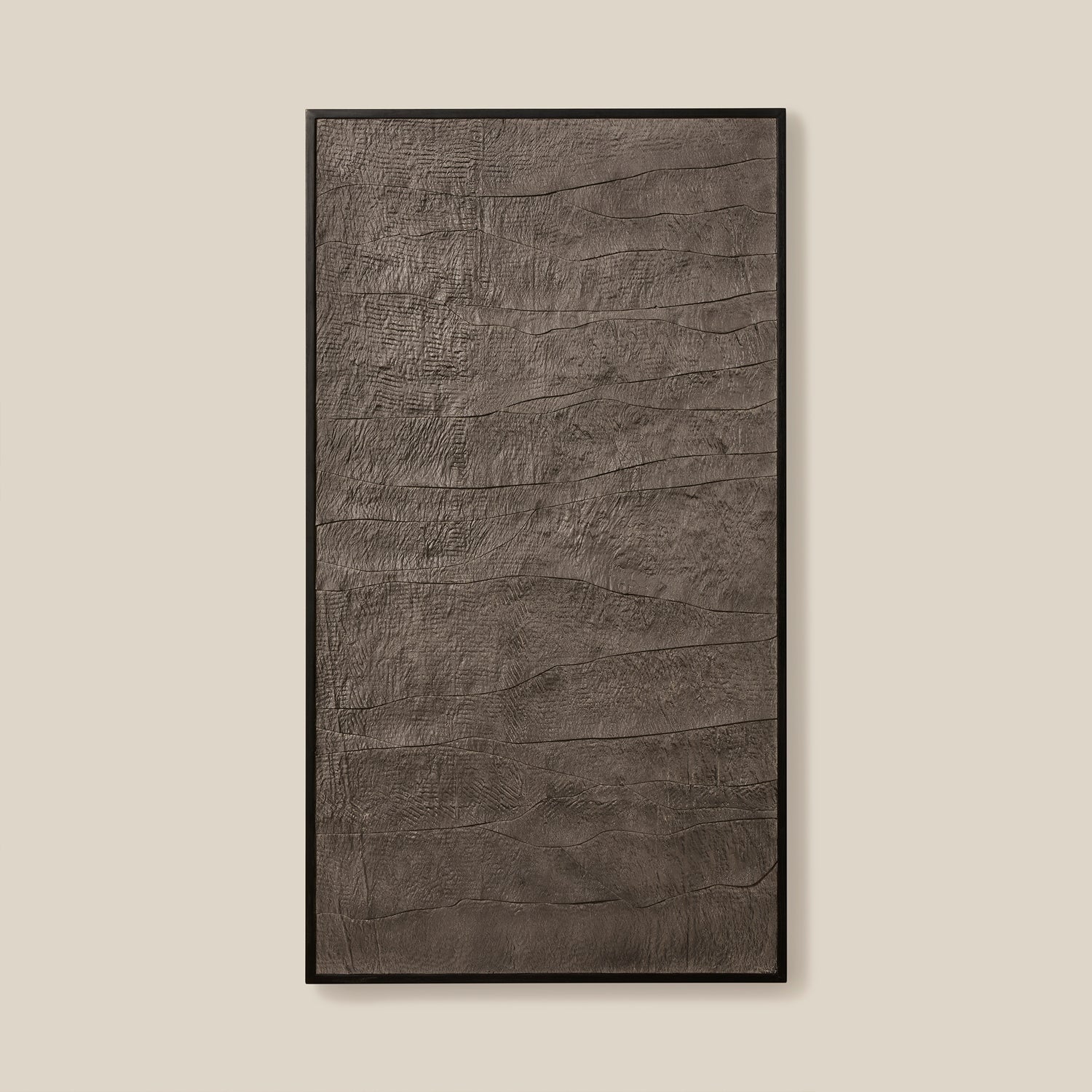 Textured rectangular object with a black frame on a beige background- Number 1