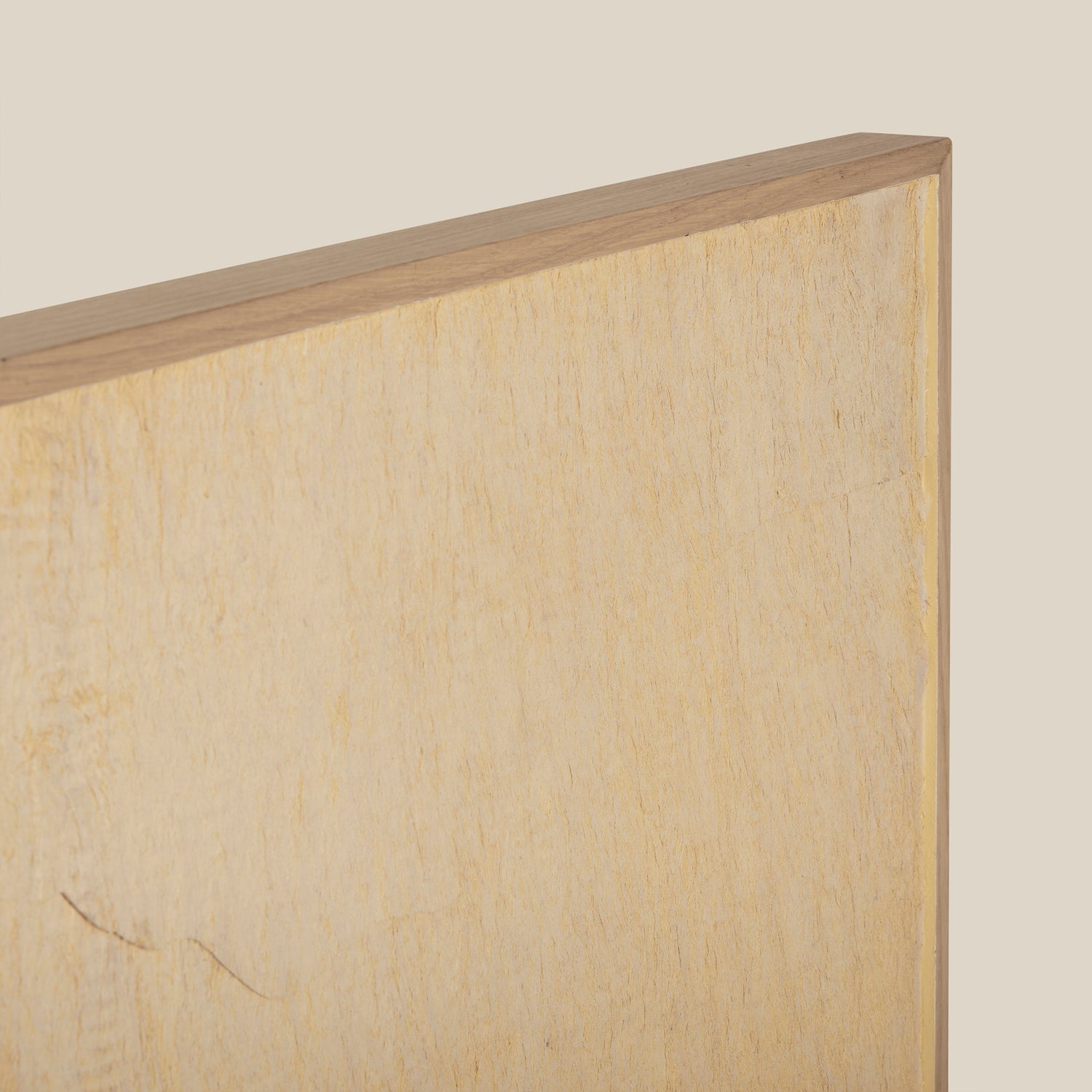 Close-up of a wooden frame with a light wood finish on a beige background- Number 5