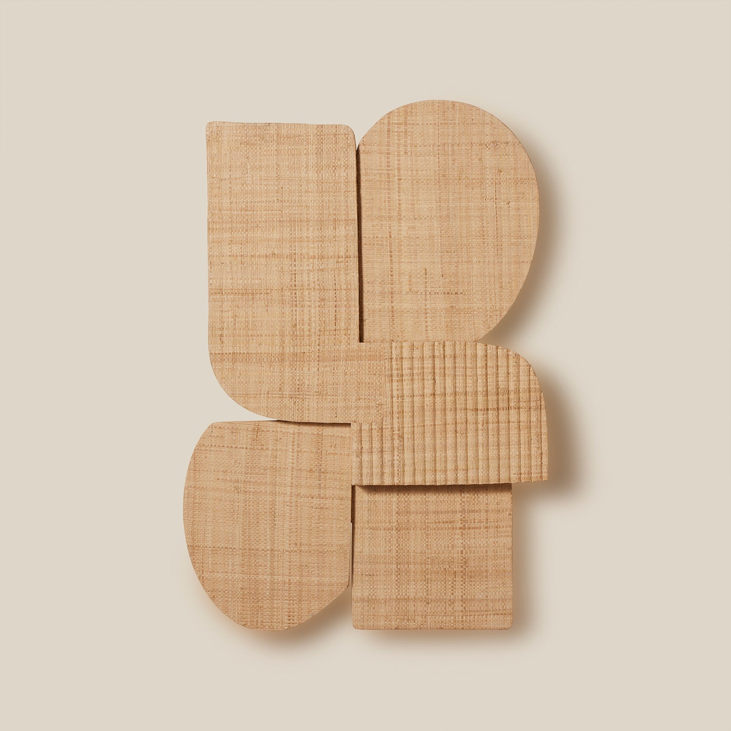 Woven rattan wall art piece on a beige background- Number 1