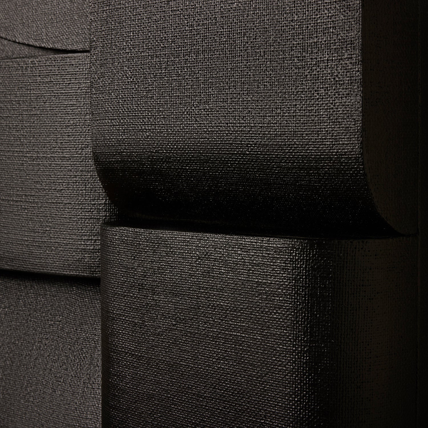 Close-up of a textured black fabric surface- Number 4