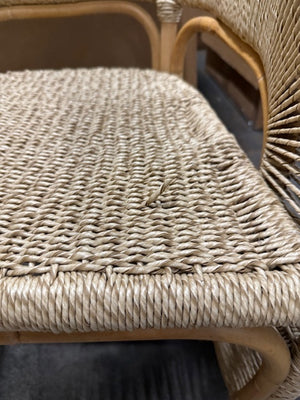 Close-up of a wicker chair seat with visible wear. - Number 4