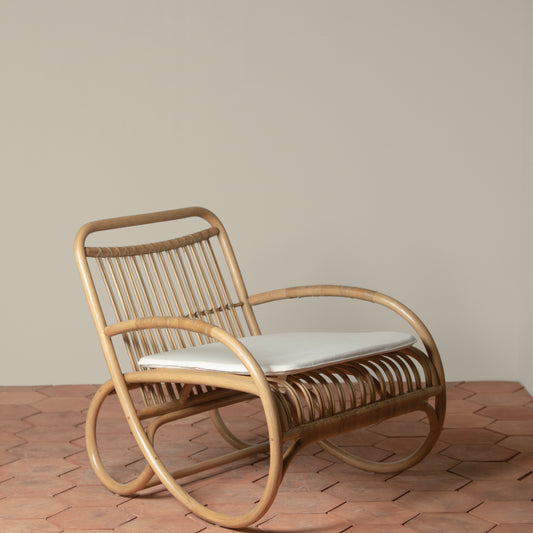 loup rattan lounge chair with linen cushion angle