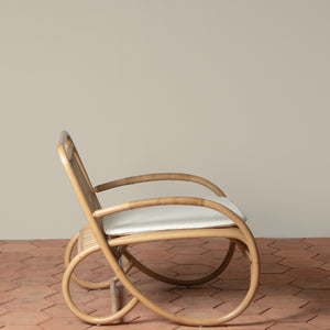 loup rattan lounge chair with linen cushion side
