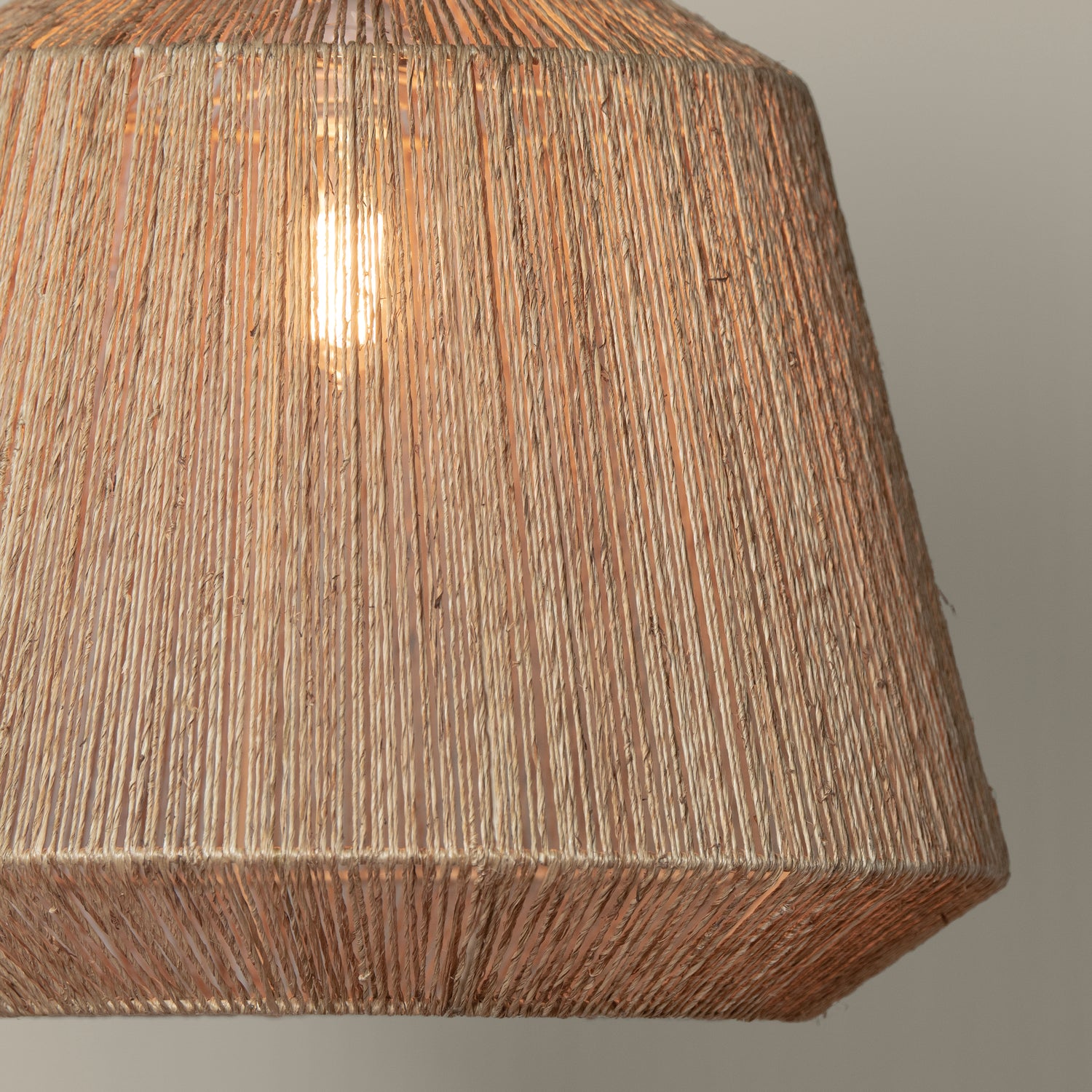 manhattan jute pendant in natural with light on detail