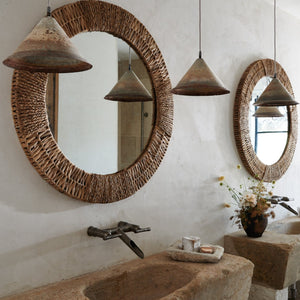 folha round mirror in natural above sink