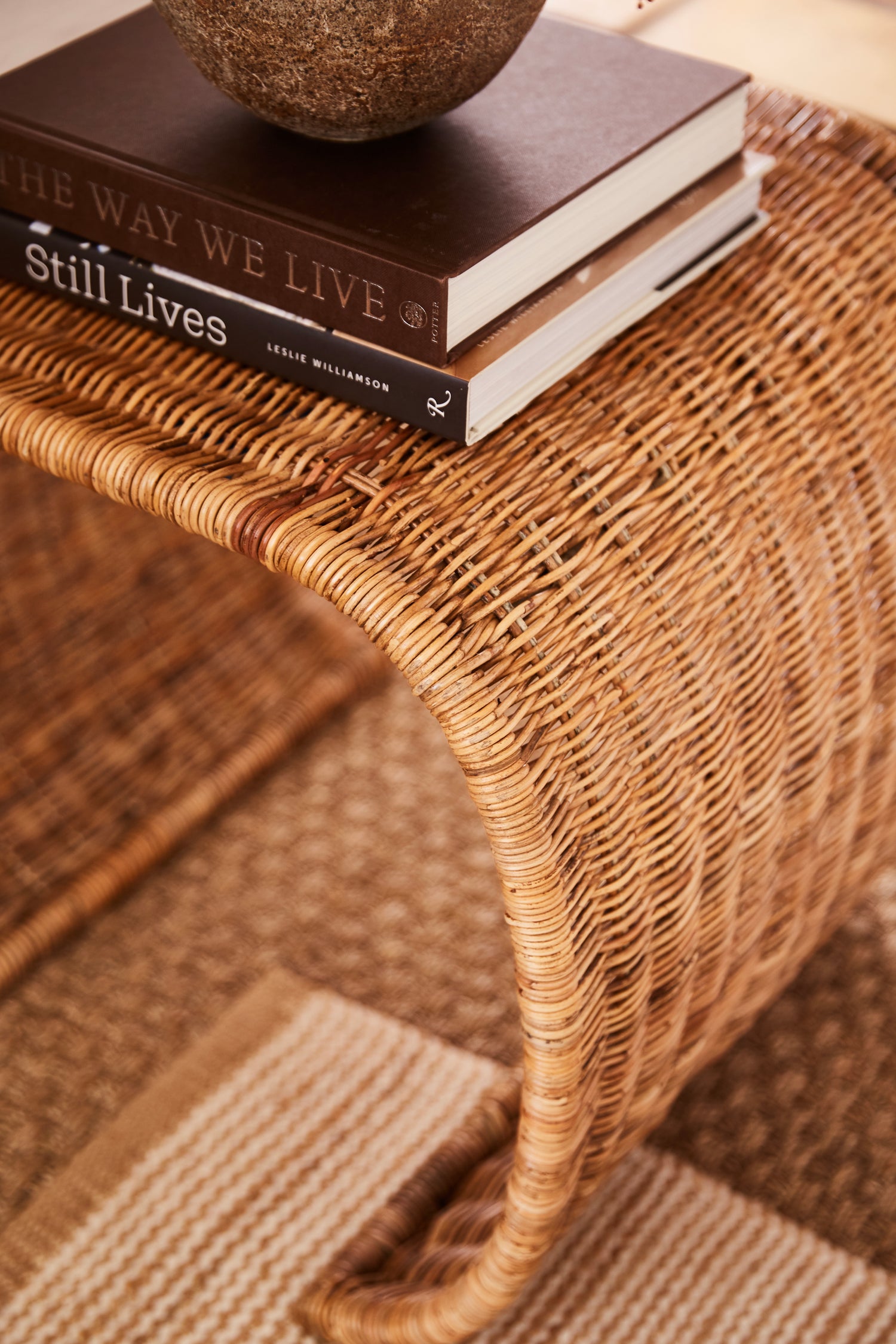Healdsburg wicker side table with books